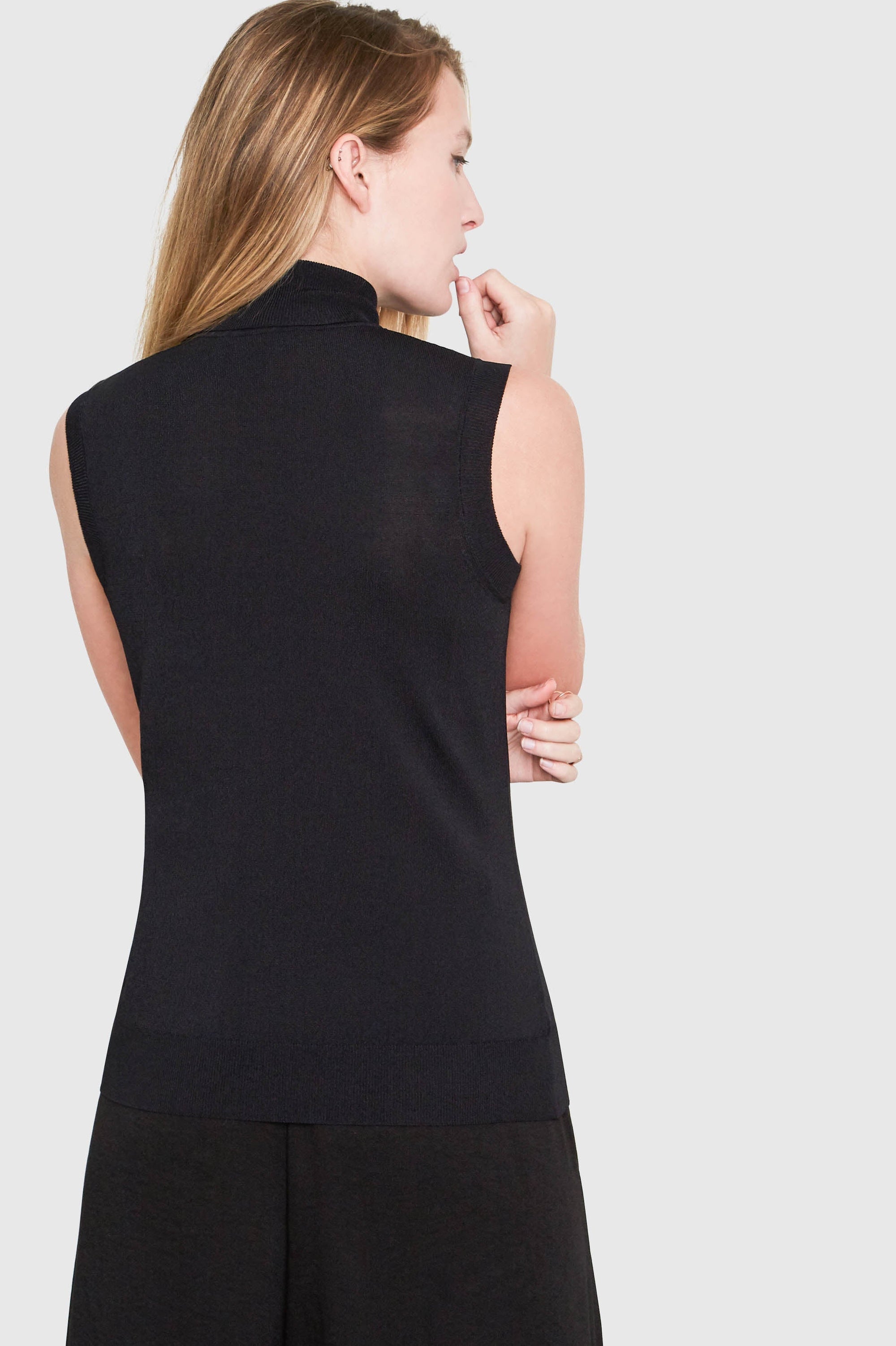 Hepburn Sleeveless Turtleneck Sweater in black, side close view — Santicler Japandi fashion