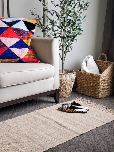 Korissa Goldilocks Rug, natural, styled in living room, angled view