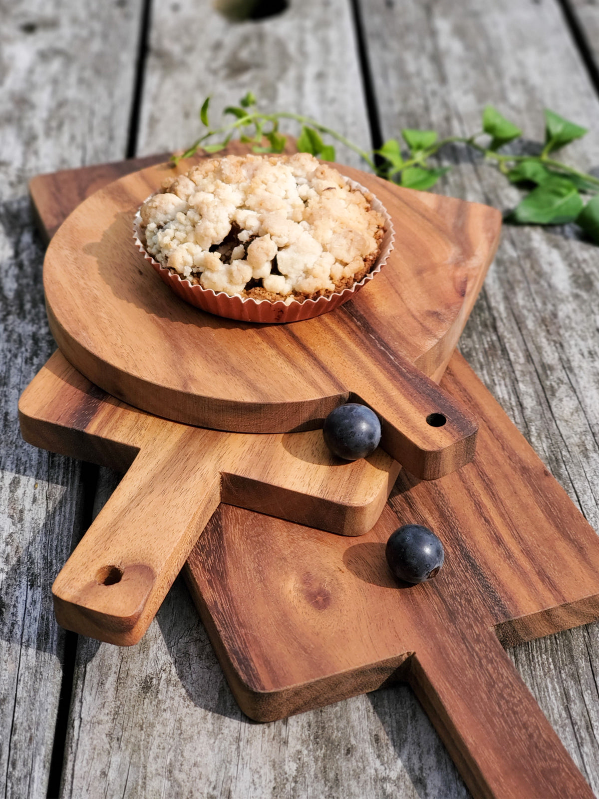Korissa Wooden Serving Board with tart, blueberries, and round board