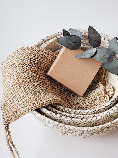 Korissa Hemp Washcloth rolled in basket with gift box, close angle