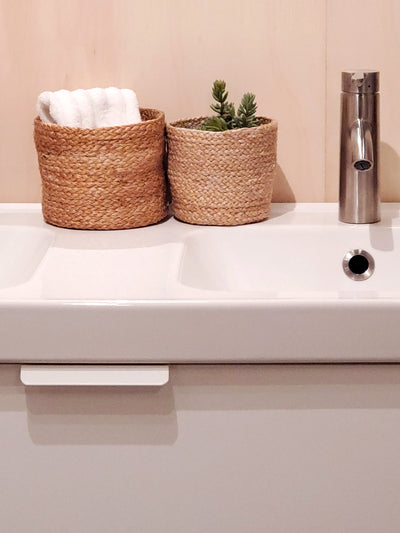 Korissa Kata Bin on bathroom sink counter with towels