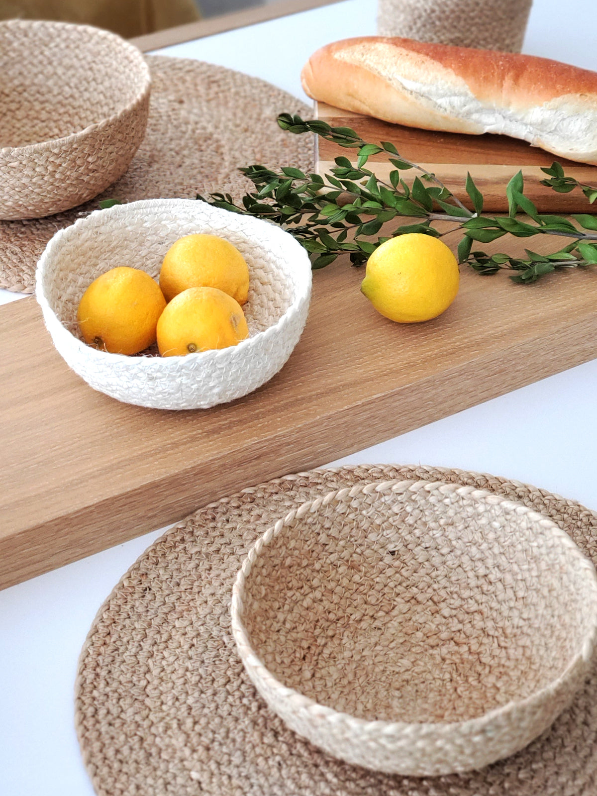Korissa Kata Natural Placemat styled with lemons, bread, and woven bowl