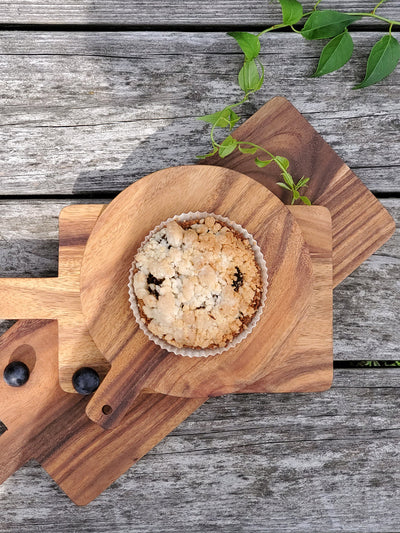 Korissa Wooden Round Serving Board with tart, blueberries, overhead angled view