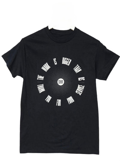 Front product view of the black Service Tee with the circular graphic printed in white.