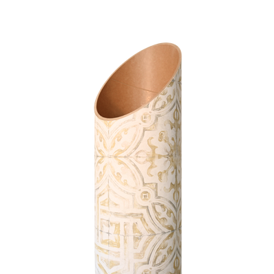 Close-up of the tube’s angled open top, showing its copper-toned interior and embossed-looking gold pattern.