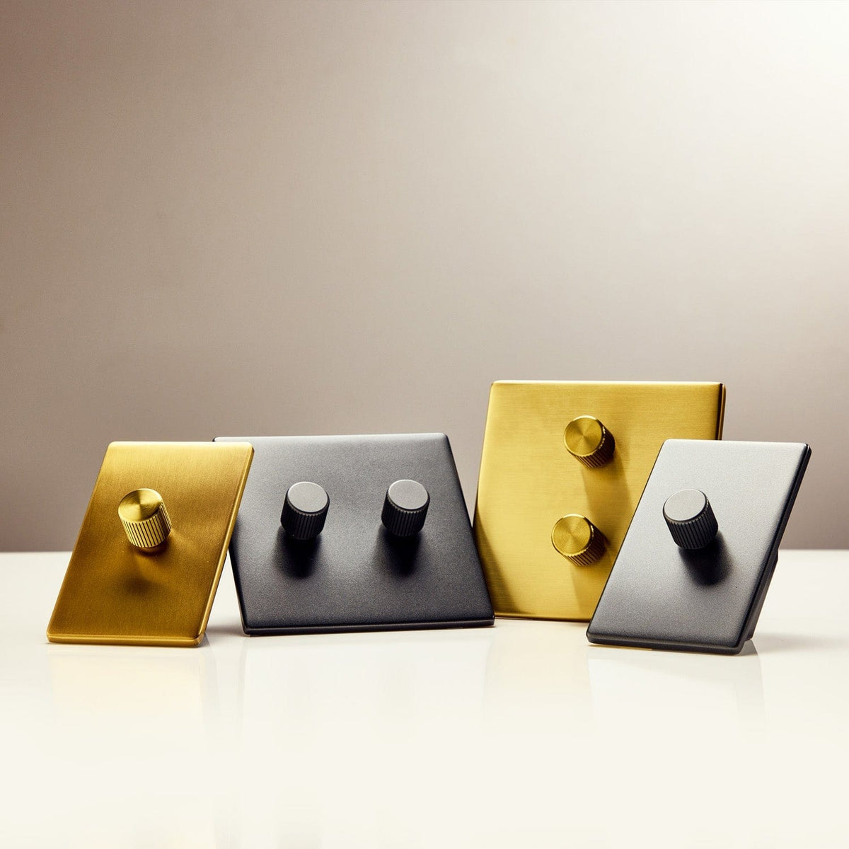 Double Rotary Wall Dimmer in Brass - shown with dimmer collection lineup