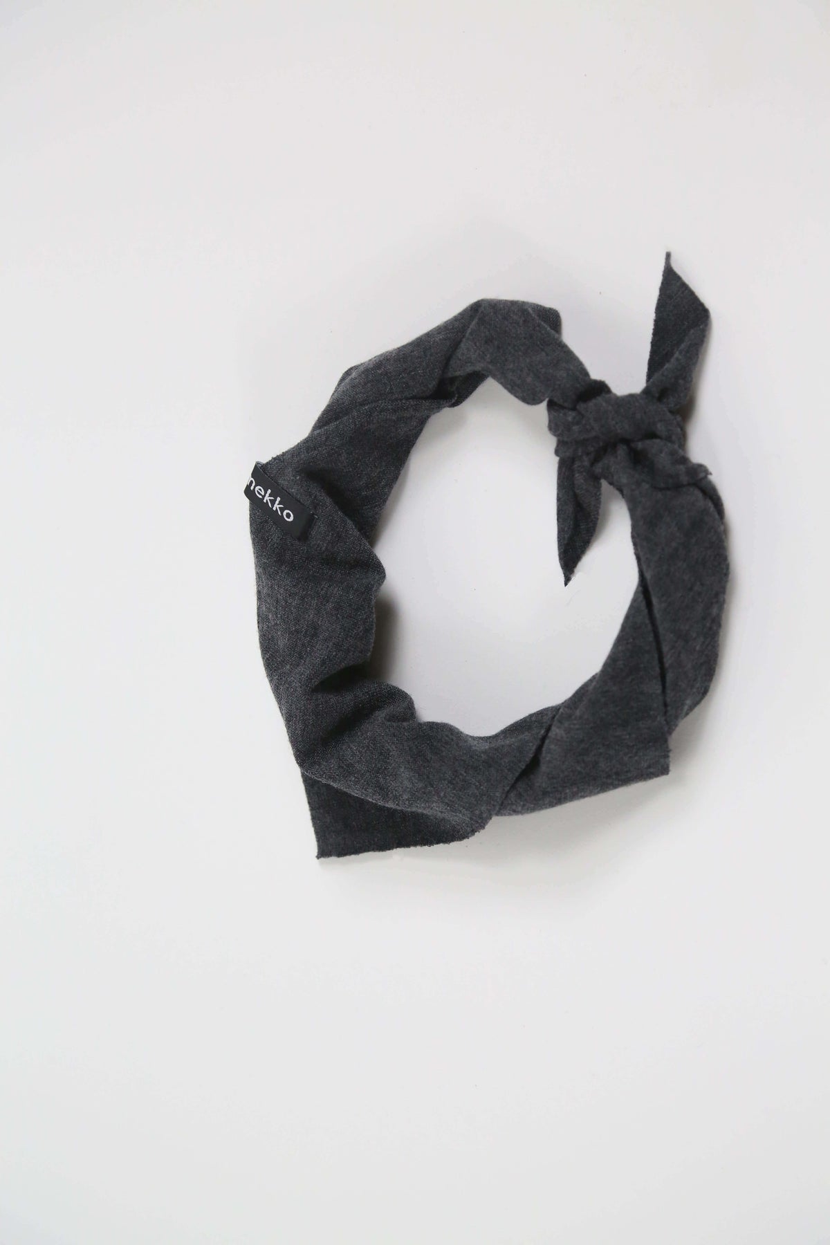 Merino wool bandana in charcoal gray designed for sauna, recovery rituals, travel, and everyday wear.