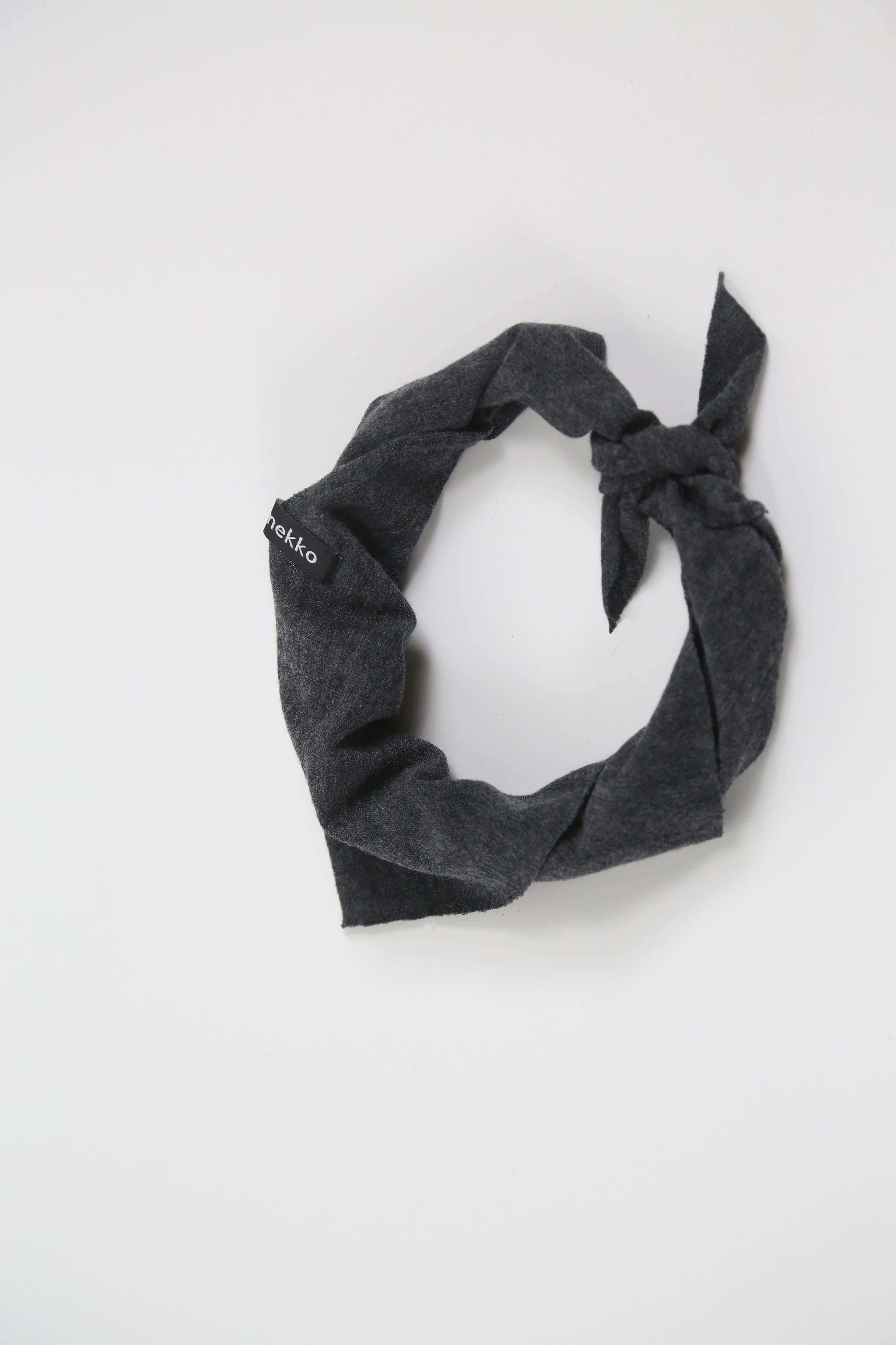 Merino wool bandana in charcoal gray designed for sauna, recovery rituals, travel, and everyday wear.