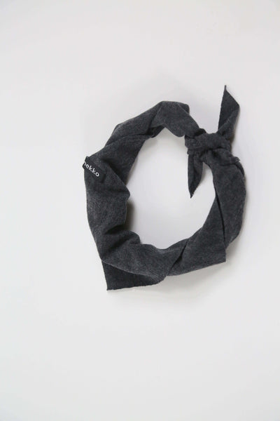 Merino wool bandana in charcoal gray designed for sauna, recovery rituals, travel, and everyday wear.