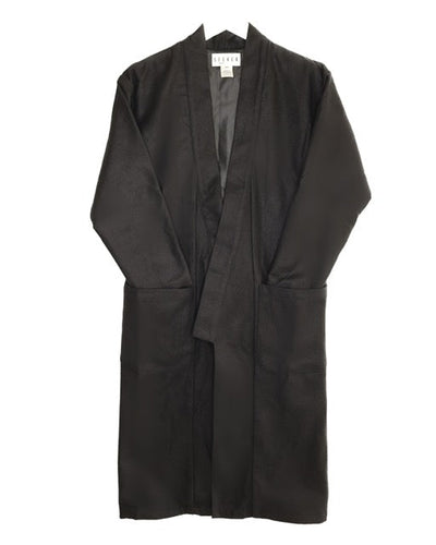 Front product view of the black wool kimono with an open front and large patch pockets.