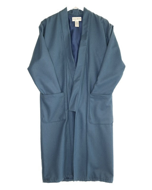Front product view of the muted blue wool kimono with an open front and large patch pockets.