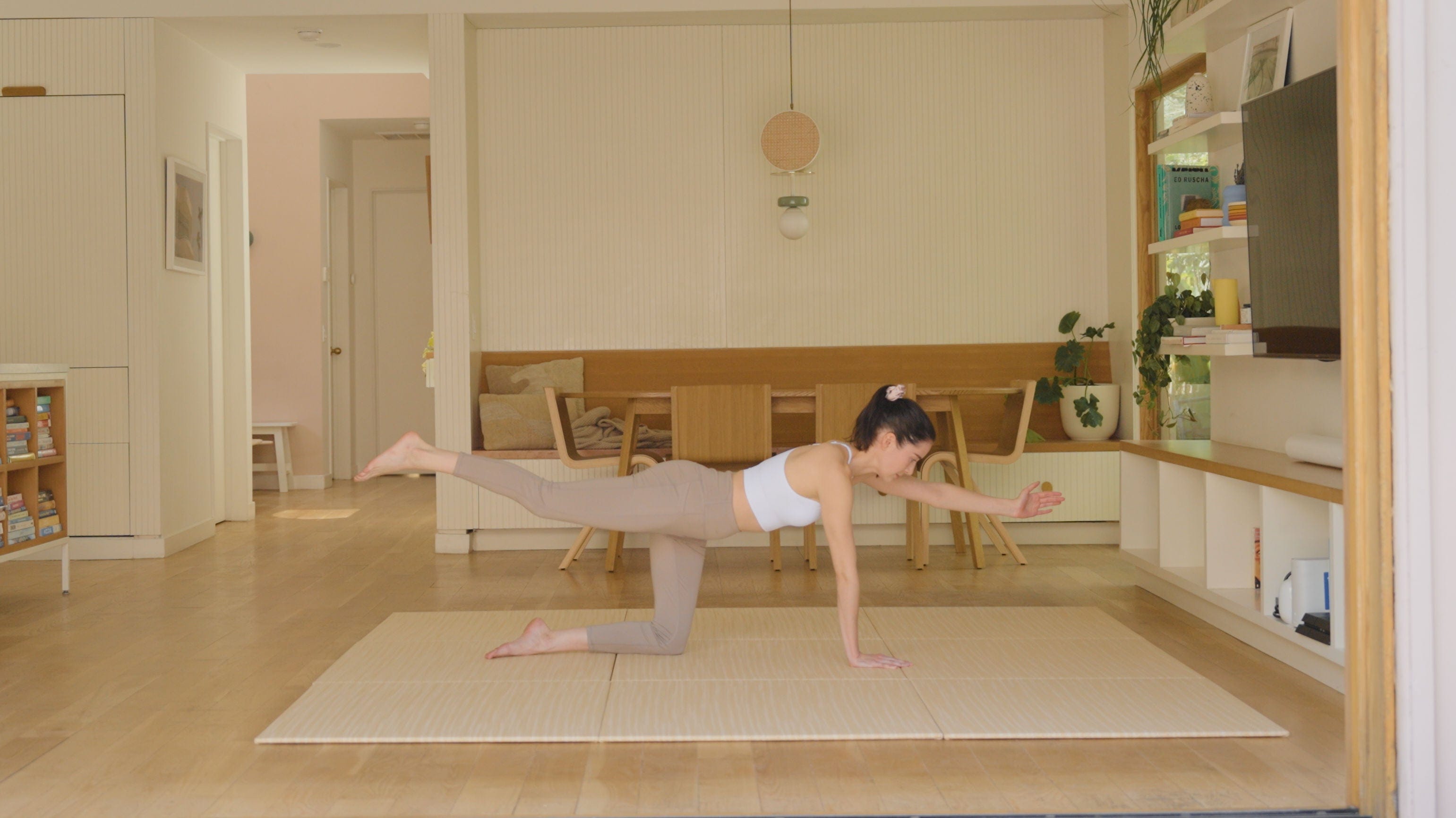 Woman doing yoga on Japandi Tatami Mats shown 9 Mats HONAMI White Brown