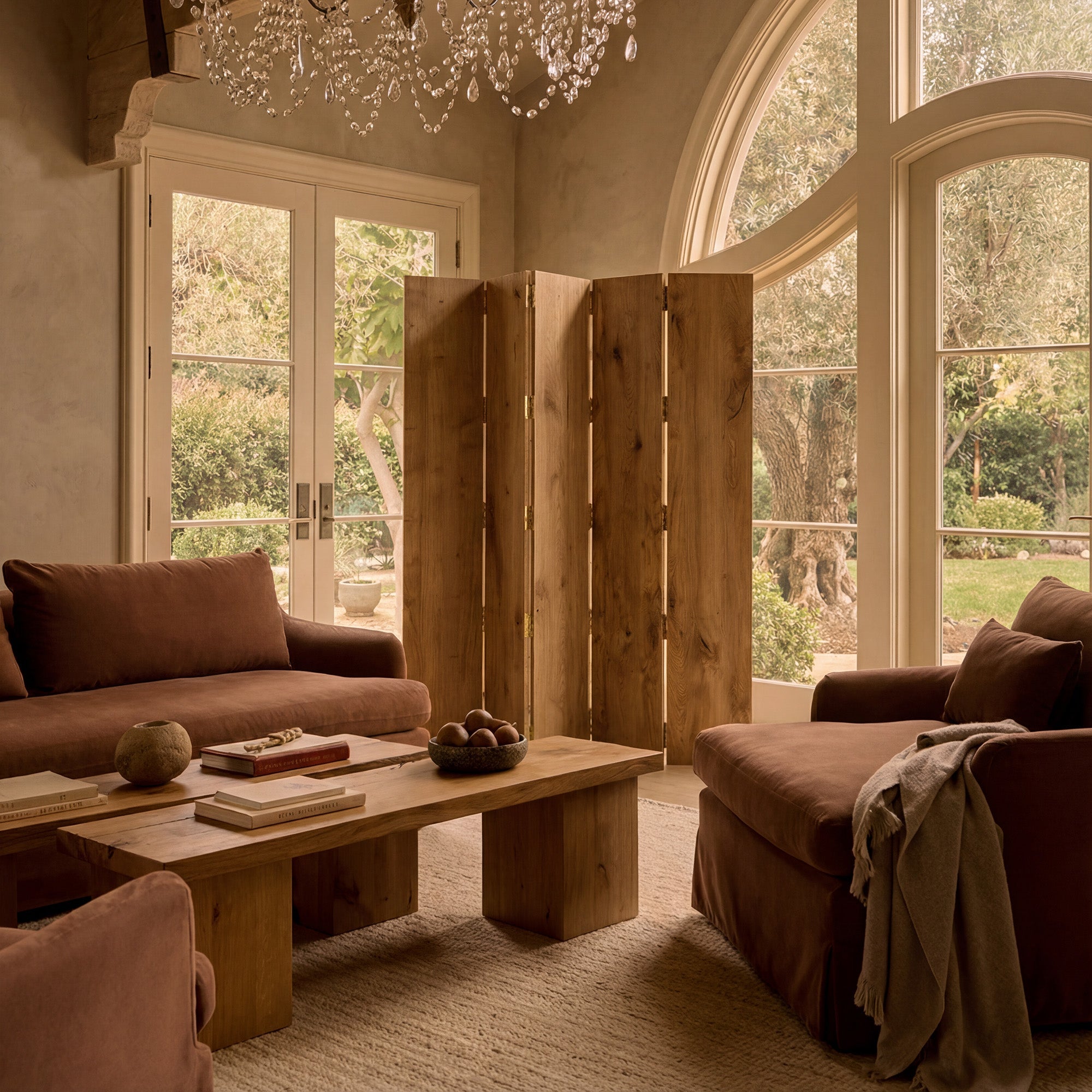 Living room with brown sofas, wooden coffee table, and large windows with Antwerp Screen by House of Leon.
