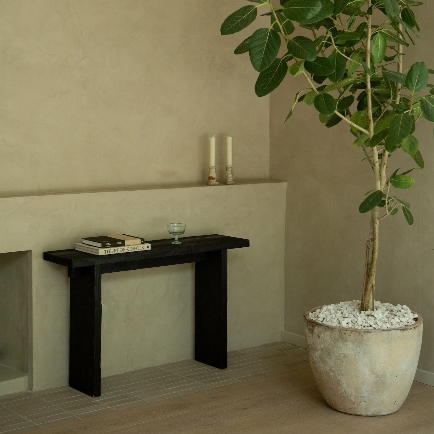 Modern black console table with Shou Sugi Ban finish in entryway
