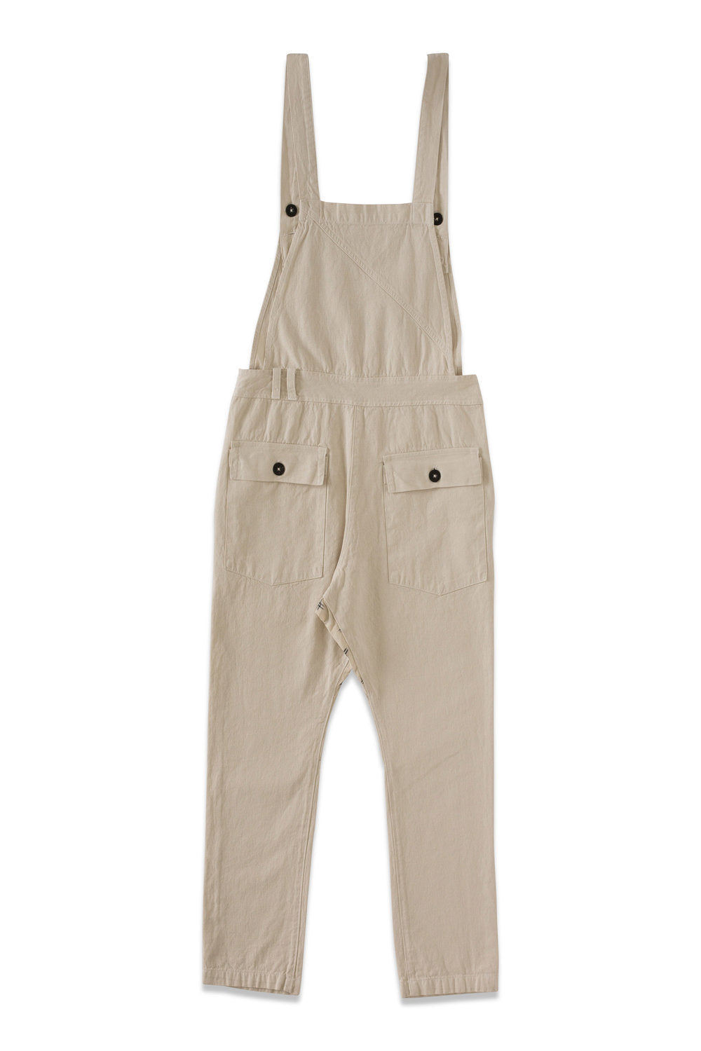 Back product view of cream overalls with side buttons and rear pockets.