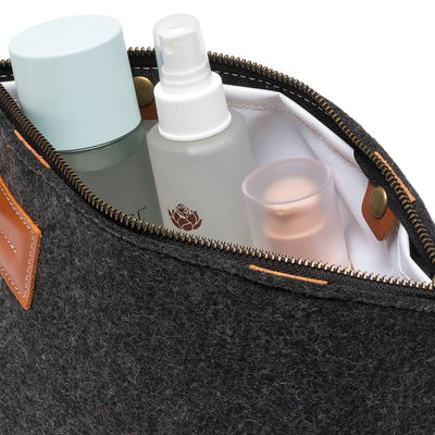 Interior of Kyrgies travel organizer featuring natural wool felt construction and organized storage
