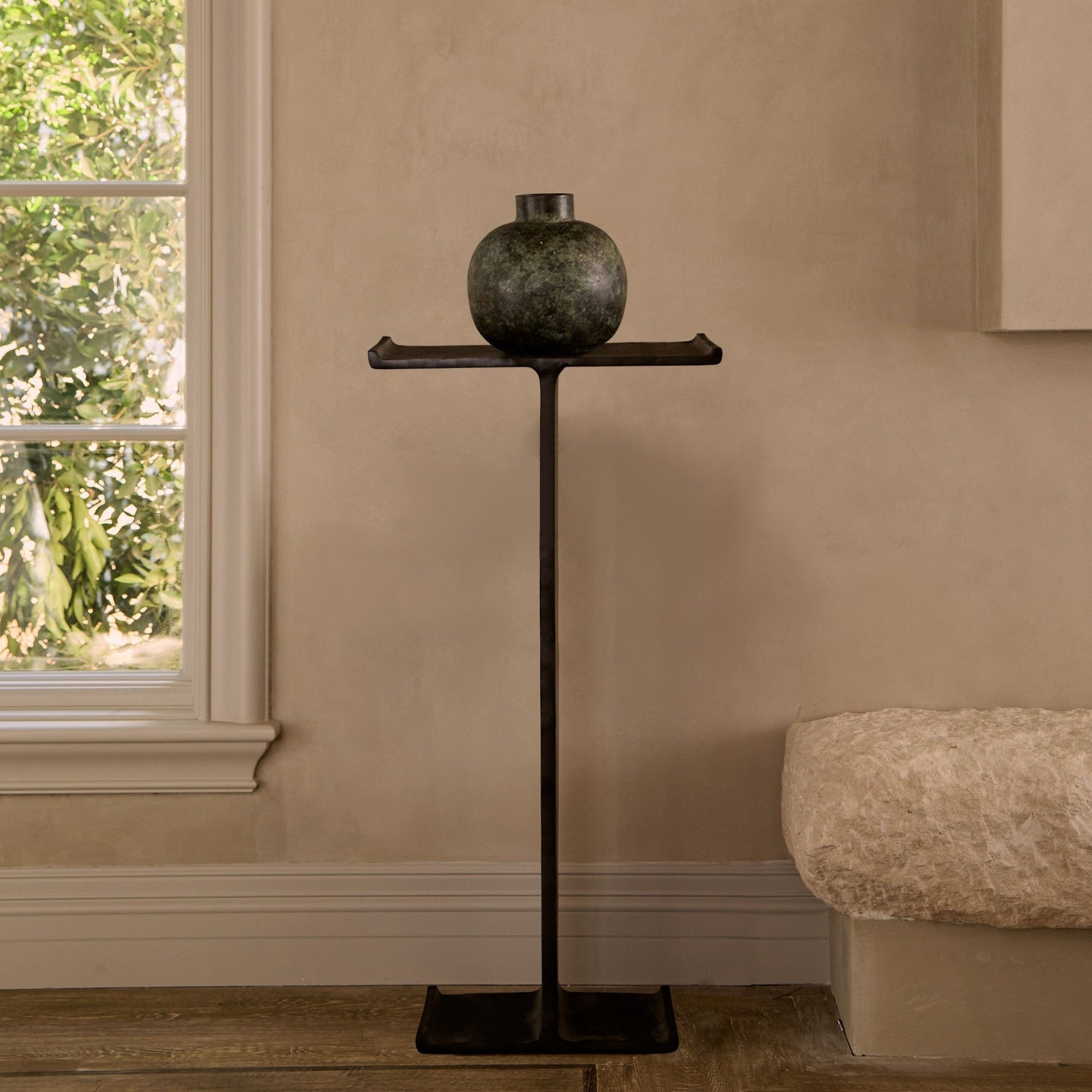 Minimal black cast iron finish pedestal table inspired by industrial I-beams