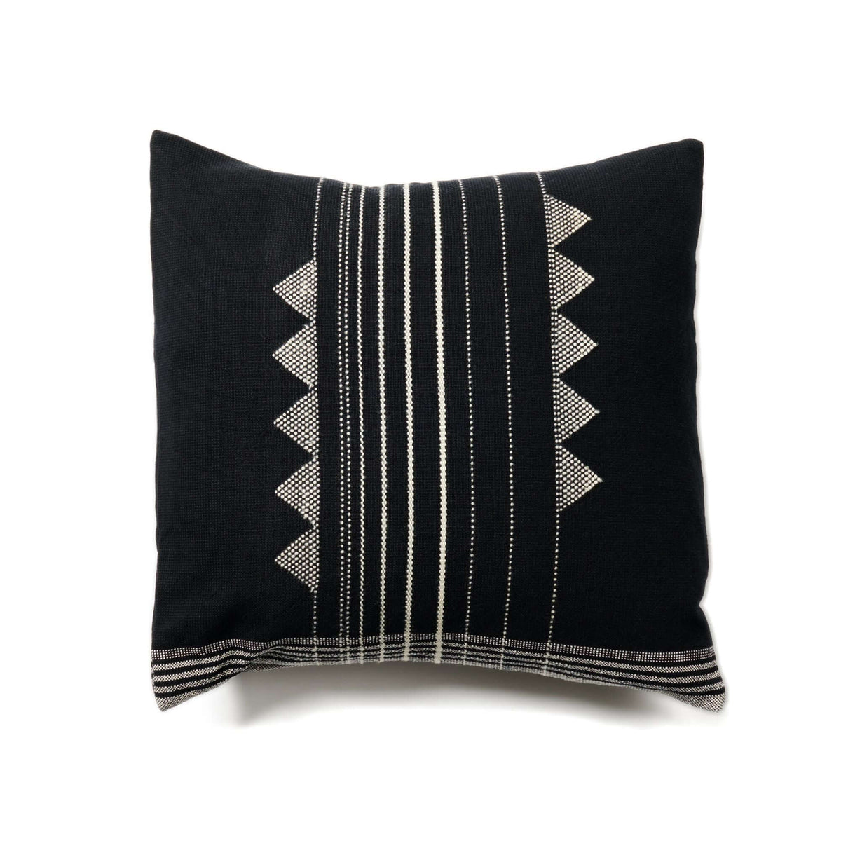 Black colorway of the Kora pillow with ivory pinstripes and triangular geometric motifs.