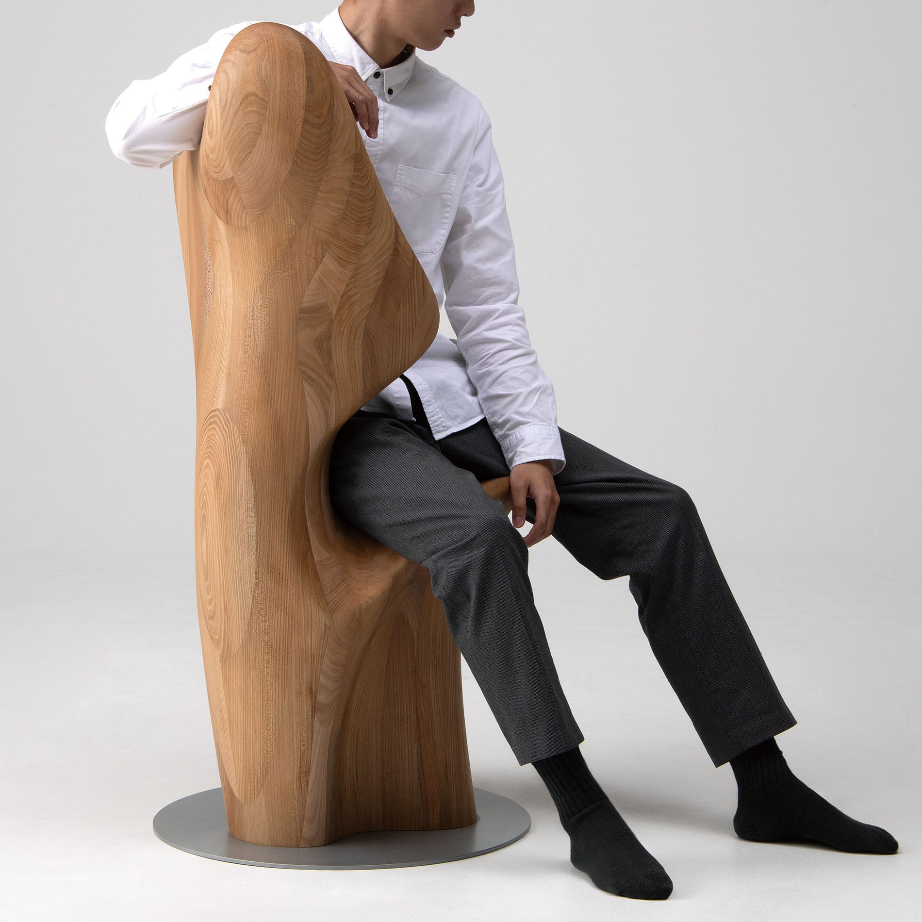 Person seated on Japandi HUG Chair by CondeHouse showing scale and form