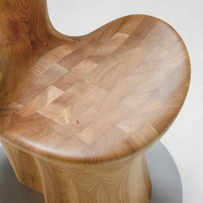 Close-up of Japanese Elm seat detail on HUG Chair by CondeHouse
