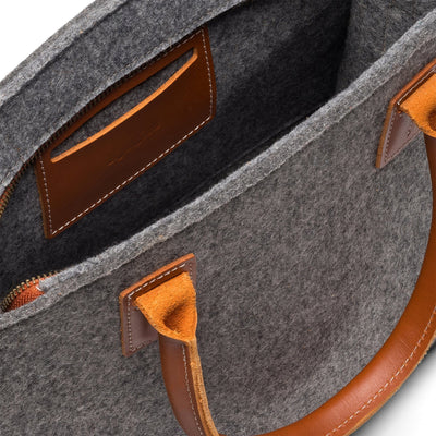 Interior of Kyrgies wool handbag featuring soft wool felt lining and storage pocket