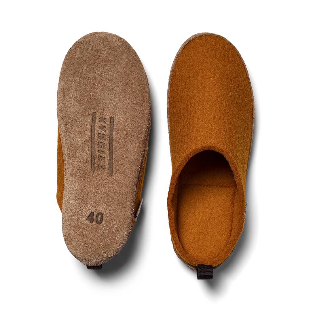 Kyrgies Indoor Wool Slides, rust, top-down view of leather sole beside felt upper