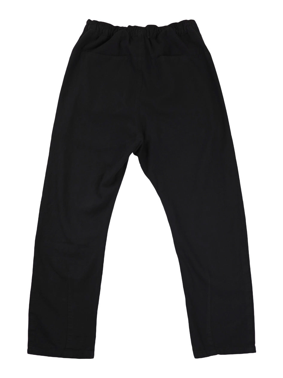 Back product view of black Canvas Souk pants with an elastic waistband.