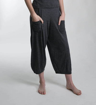 Full-length view of charcoal merino wool lounge pants featuring a relaxed silhouette for recovery, travel, and everyday wear.