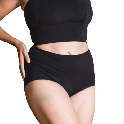 Model wearing Organic Cotton High-Rise Brief in Black, front view