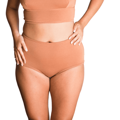 Model wearing Organic Cotton High-Rise Brief in Maya Nude, front view