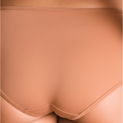 Back view of model wearing Organic Cotton Mid-Rise Brief in Maya Nude