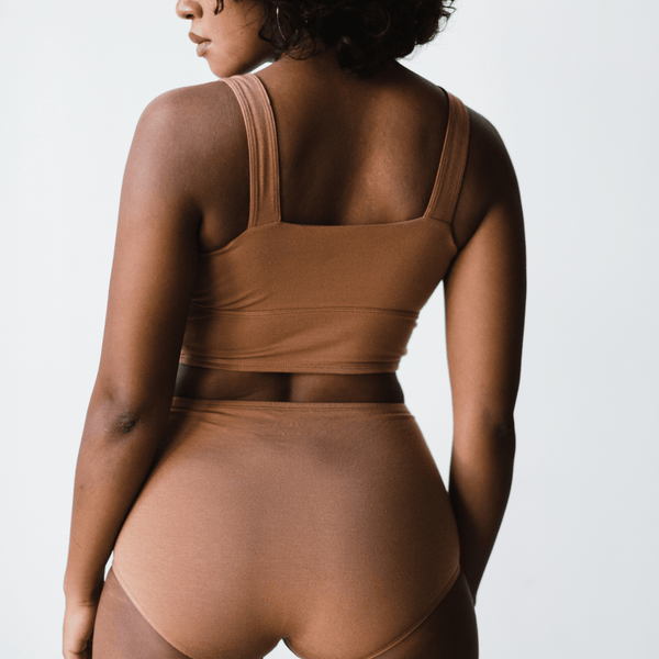 Back view of model wearing PROCLAIM Organic Cotton Square Neck Bralette in Maya Nude