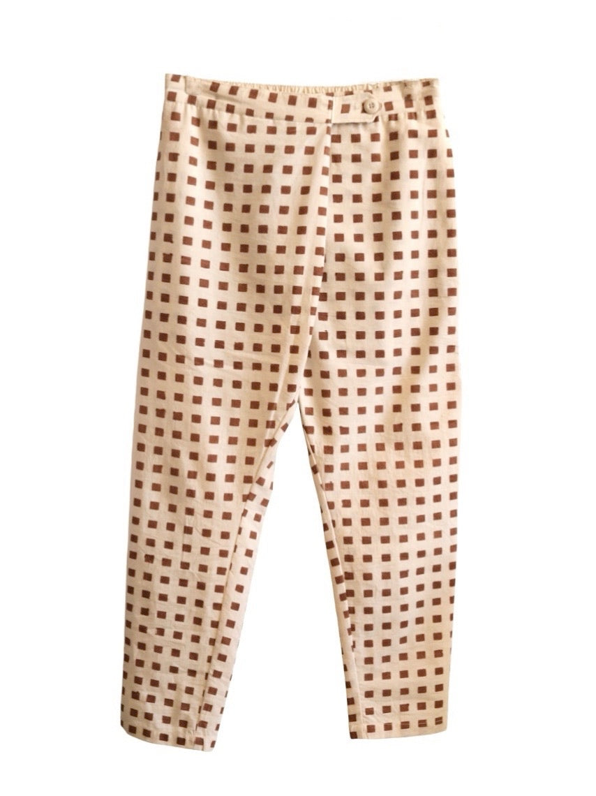 Front product view of cream Souk pants with rust-red hand-block-printed squares.