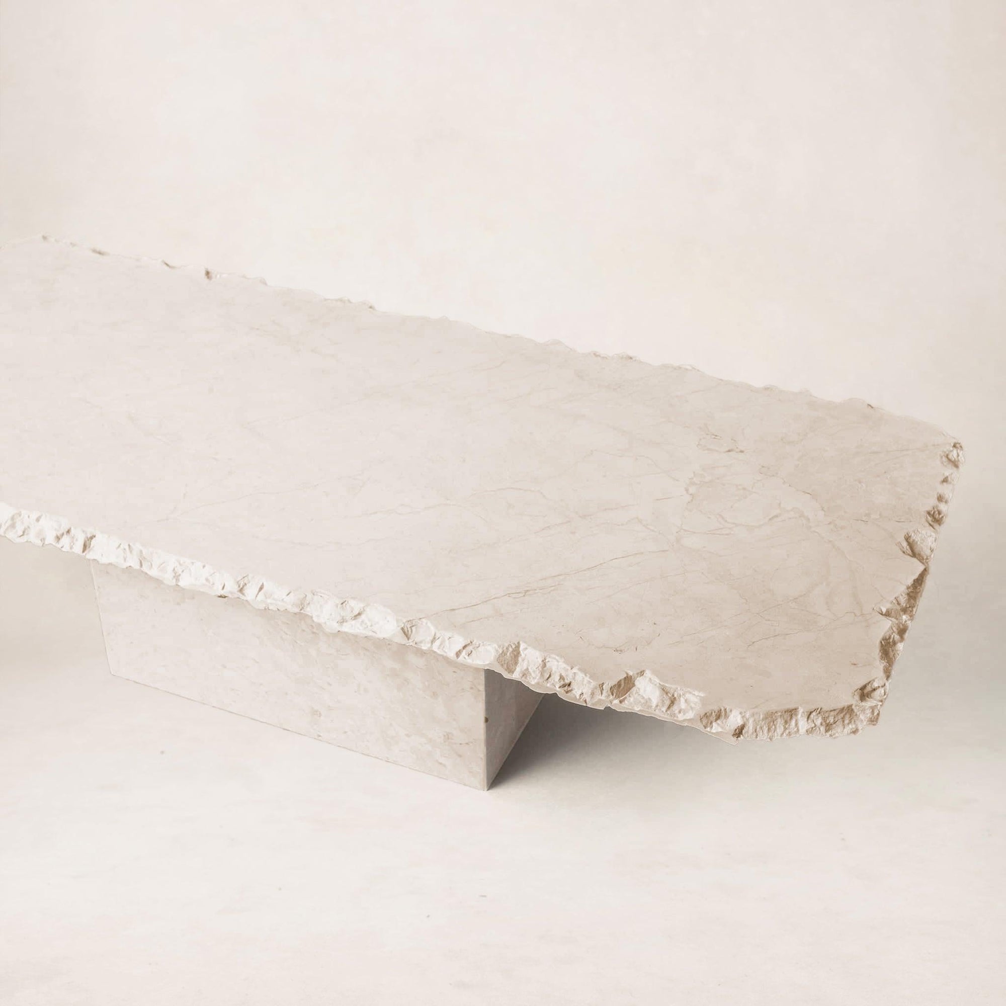 Sofita marble coffee table highlighting sculptural form and natural stone texture