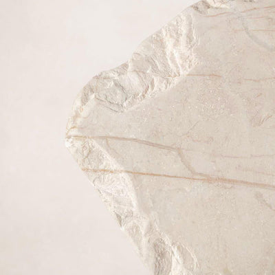 Hand-chipped edge detail on handcrafted Sofita marble coffee table
