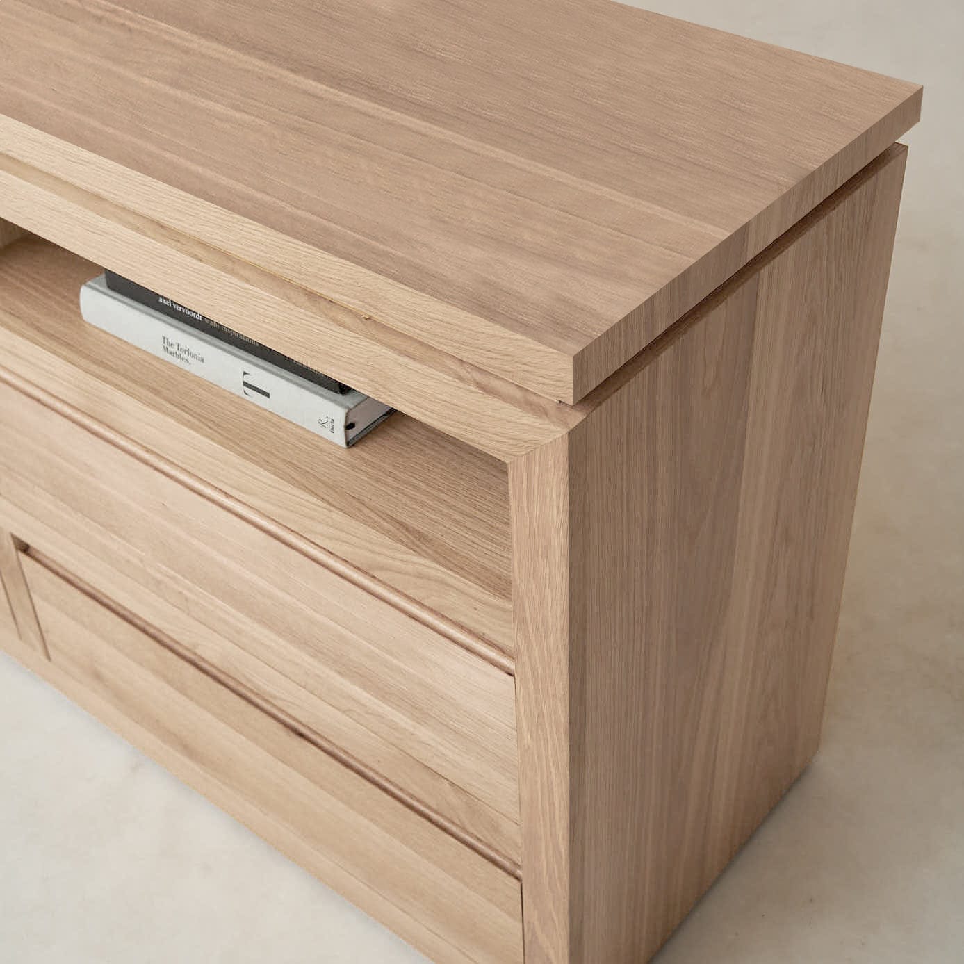Close-up of Sofita dresser drawer with solid oak construction and soft-close slide