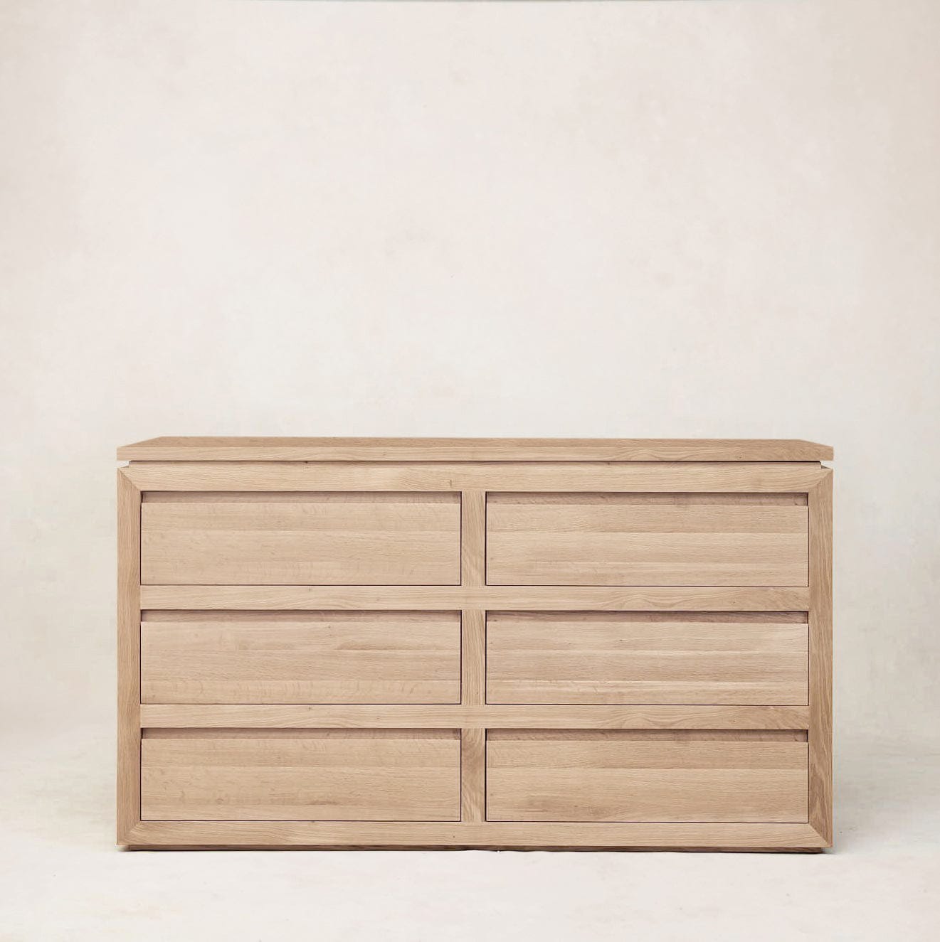 Front view of Sofita dresser highlighting clean lines and oak grain