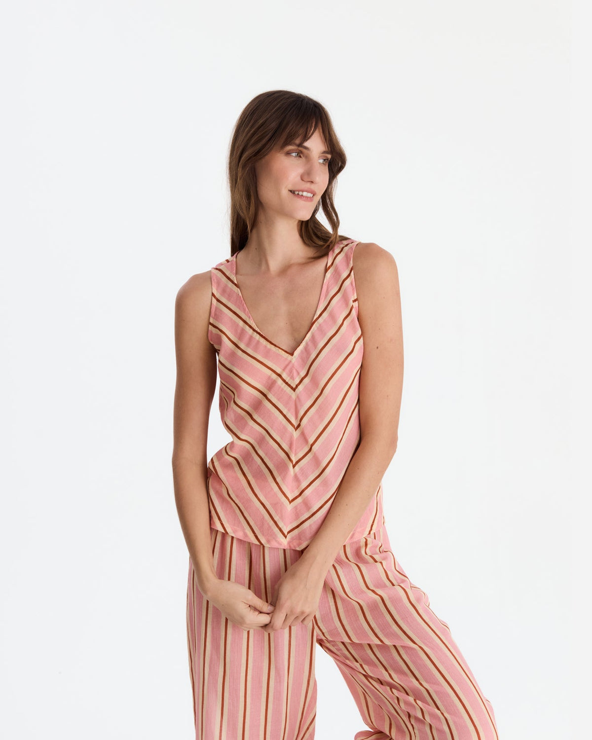 Closer front view showing diagonal stripes meeting in a chevron pattern on the top and vertical stripes on the relaxed pants.