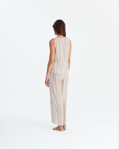 Back view of the pajama set, showing the top’s straight neckline, vertical back stripes, and matching loose-fitting pants.
