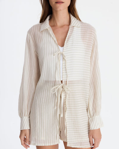 Close-up of the collar, front ties, contrasting stripe directions, and wide cuffs, with matching shorts underneath.